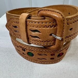 Tan leather belt with cutouts showing multicolor embroidery 32